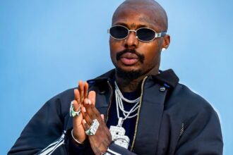 Asake announcing his fourth studio album M$NEY release date with marble statue artwork reveal on social media
