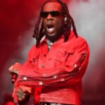 Burna Boy Love, Damini album review editorial style image showing reflective portrait, emotional storytelling theme, and Ladysmith Black Mambazo collaboration moment