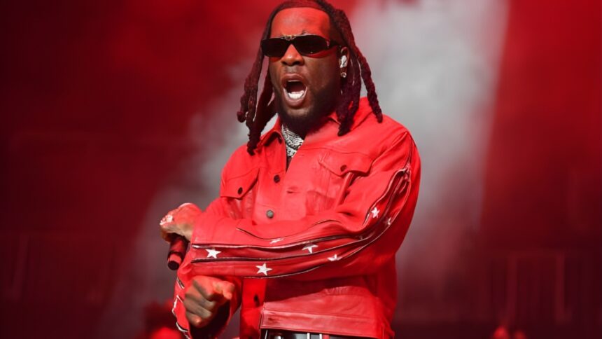 Burna Boy Love, Damini album review editorial style image showing reflective portrait, emotional storytelling theme, and Ladysmith Black Mambazo collaboration moment