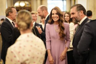 Kate Middleton wearing Queen Elizabeth’s pearl necklace and Bahrain pearl earrings at Buckingham Palace 100th birthday tribute