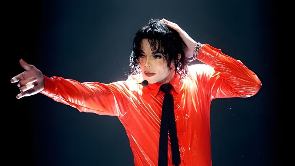 Michael Jackson biopic promotional image featuring Jaafar Jackson in character as Michael Jackson during the Beat It era, representing the film Michael’s record-breaking box office success and global attention