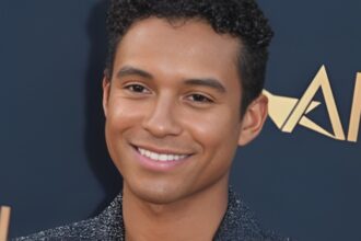 Michael Jackson biopic promotional image featuring Jaafar Jackson in character as Michael Jackson during the Beat It era, representing the film Michael’s record-breaking box office success and global attention