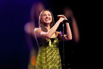 Olivia Rodrigo celebrating UK Number 1 chart success while Justin Bieber and other artists appear in a music chart collage showing Top 40 movement