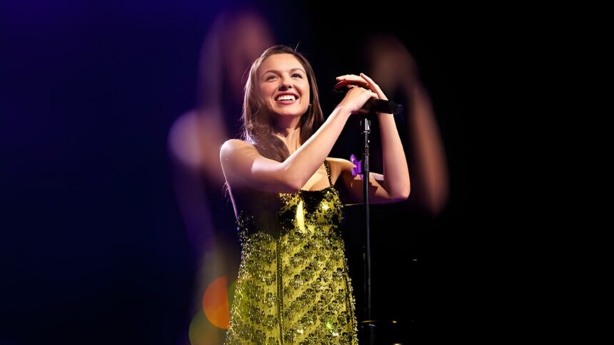 Olivia Rodrigo celebrating UK Number 1 chart success while Justin Bieber and other artists appear in a music chart collage showing Top 40 movement