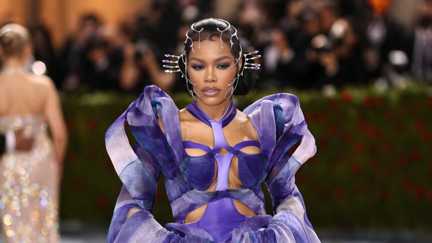 Teyana Taylor wearing bold couture at the Met Gala red carpet with dramatic styling and statement fashion look