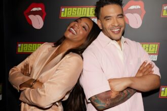 Tiffany Haddish reacting during a TV interview segment where she jokes about Nigerian singer Burna Boy in a viral clip.