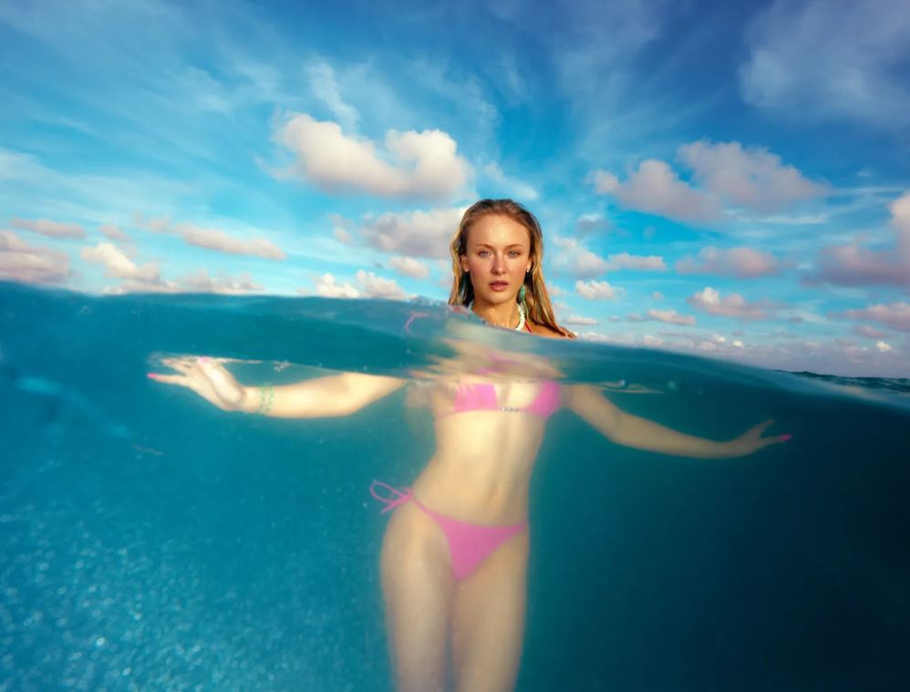 Zara Larsson wearing colorful beachy swimwear from her Main Rose collection in Miami