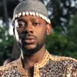Adekunle Gold and Simi smiling together during a family moment after the singer clarified rumors about welcoming twins and revealed their newborn baby’s gender.