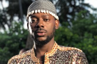 Adekunle Gold and Simi smiling together during a family moment after the singer clarified rumors about welcoming twins and revealed their newborn baby’s gender.