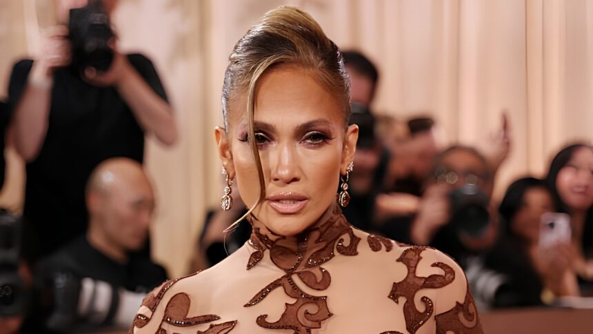Jennifer Lopez showing off her toned figure and glowing confidence in a stylish fitted outfit during a viral celebrity appearance