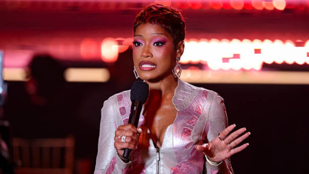 Keke Palmer wearing pink sunset ombré pixie hair with rosy eye makeup at the 2026 Billboard Women in Music Awards