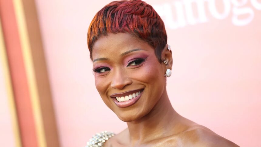 Keke Palmer wearing pink sunset ombré pixie hair with rosy eye makeup at the 2026 Billboard Women in Music Awards