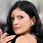 Kylie Jenner wearing a nude Schiaparelli sculptural dress with illusion details at the 2026 Met Gala