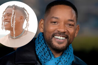 Will Smith reacting during a public appearance after a judge dismissed the sexual harassment lawsuit filed by violinist Brian King Joseph