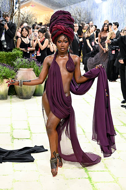 Naked dress trend at the Met Gala 2026 featuring celebrities in sheer gowns, transparent fabrics, and bold red carpet fashion looks
