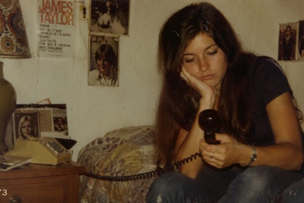Woman lying on her bed late at night staring at her phone while overthinking mixed signals and modern dating confusion.